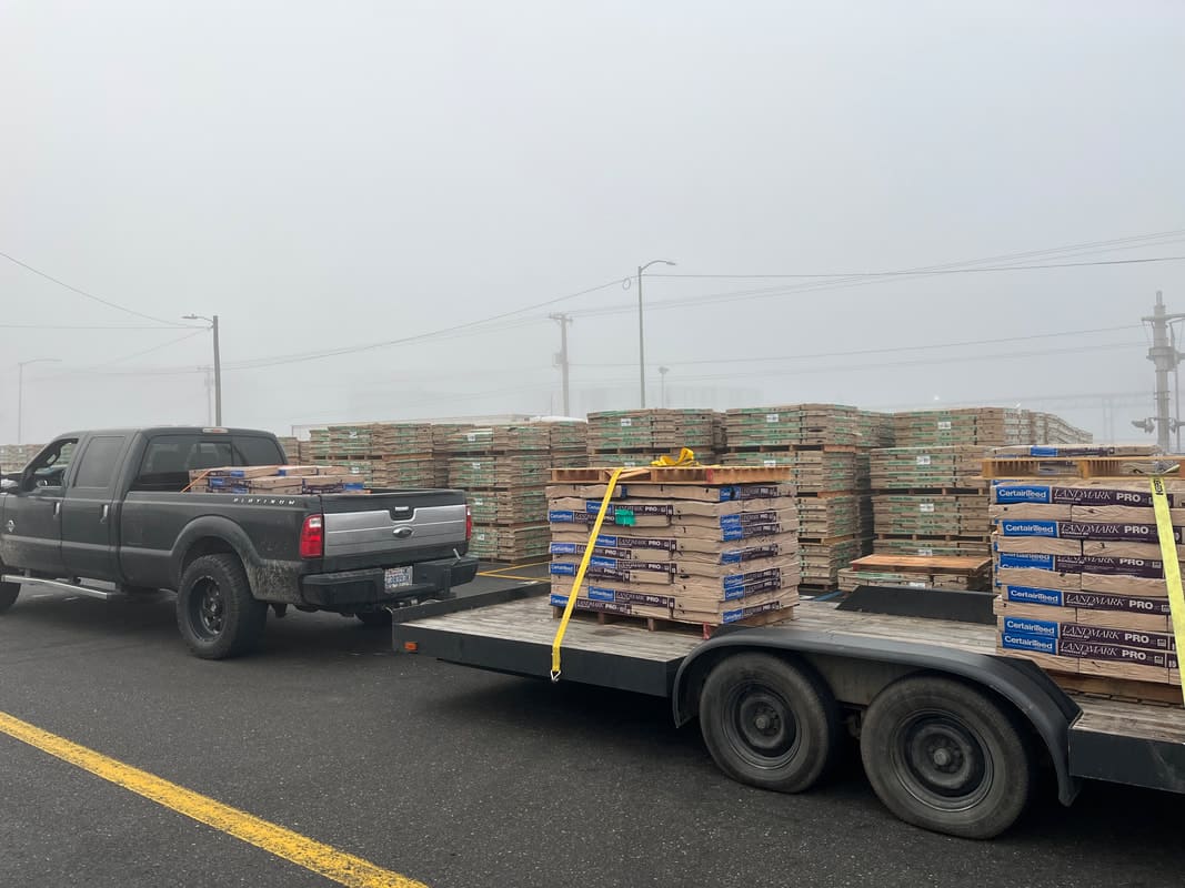 Our truck hauling CertainTeed Landmark PRO shingle pallets through Tacoma fog
